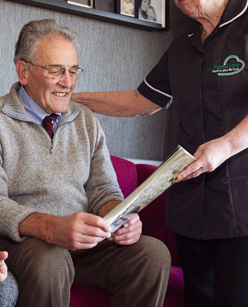 Carer sharing a warm moment with an elderly client
