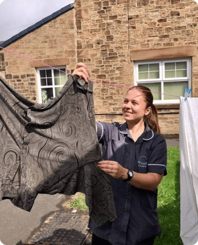 My Homecare carer helping with domestic tasks and laundry
